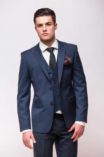https://backend.antailors.com/wp-content/uploads/2025/05/man-suit-with-word-isst.webp